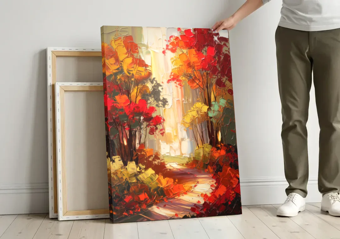Traverse City Autumn Foliage canvas wall art leaning against a wall next to blank canvases