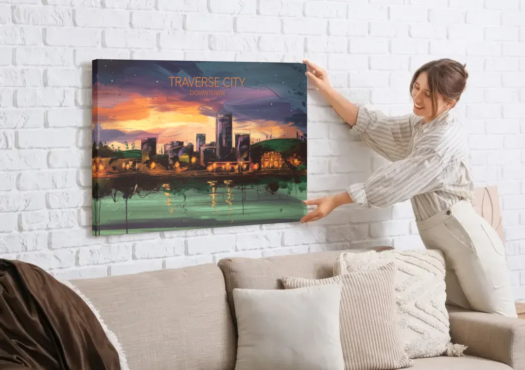 Traverse City Downtown Skyline canvas wall art being hung on a white brick wall above a sofa