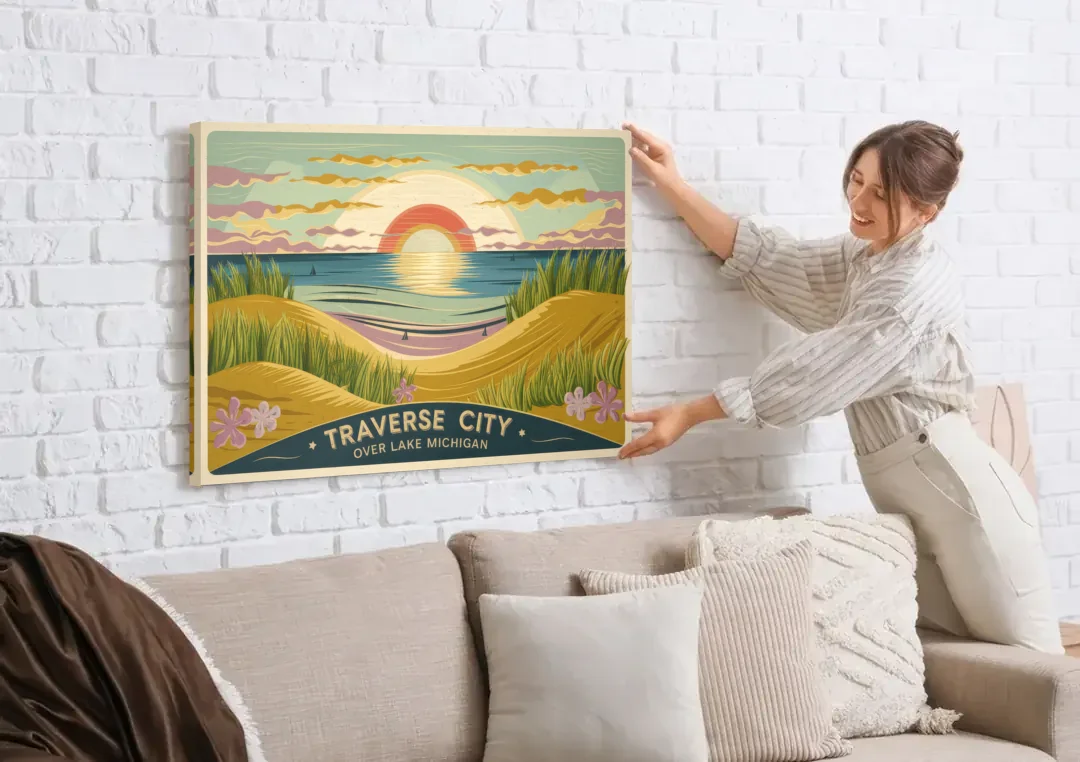 Traverse City Sunset Over Lake Michigan canvas wall art being hung on a white brick wall above a sofa