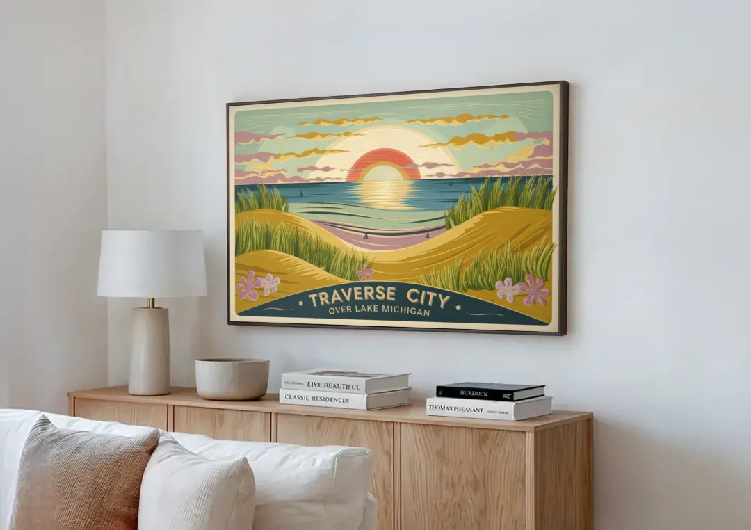 Traverse City Sunset Over Lake Michigan canvas wall art above a wooden sideboard next to a sofa