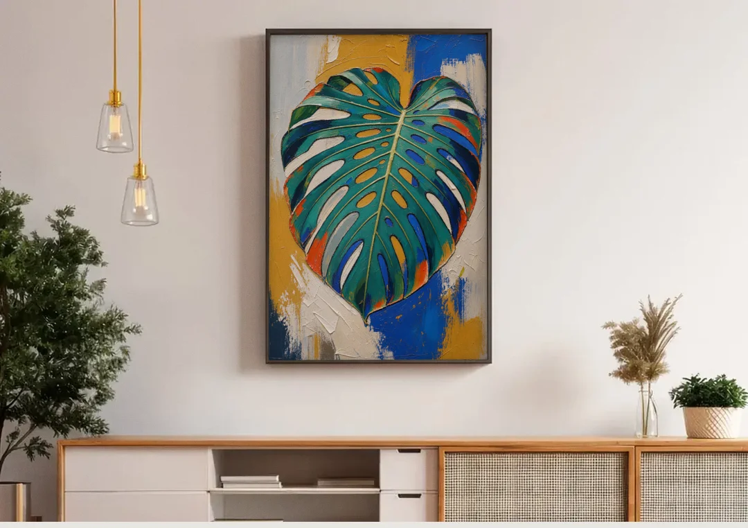 Tropical Teal Monstera Leaf Impasto canvas wall art above a wooden sideboard under pendant lights