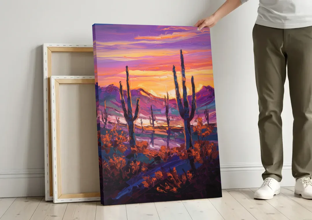 Tucson Saguaro Silhouettes canvas wall art leaning against a wall next to blank canvases