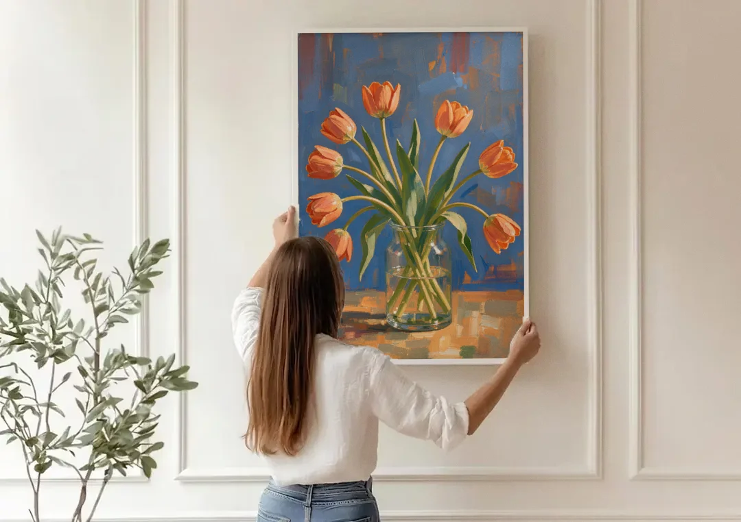 Tulip Painting Canvas in a Clear Glass Vase canvas wall art being hung on a paneled wall