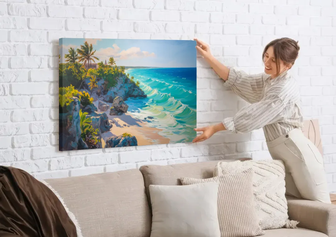 Tulum Ocean Cliffs canvas wall art being hung on a white brick wall above a sofa