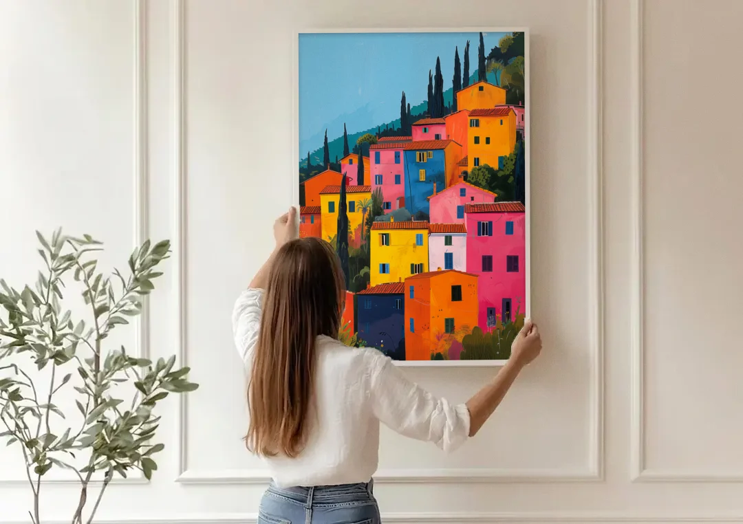 Tuscan Art of Colorful Hill Houses canvas wall art being hung on a paneled wall