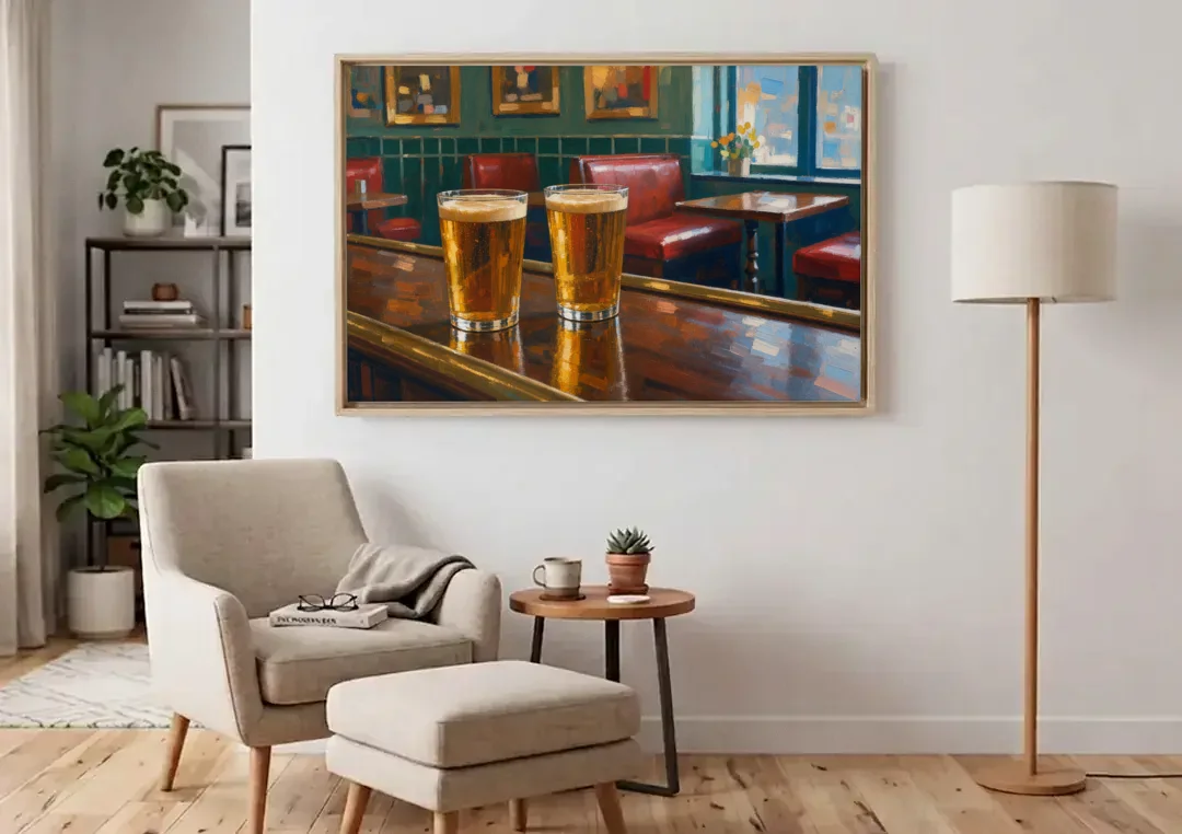 Two Amber Pints at the Brass Rail for the Pub canvas wall art above an armchair in a bright living room