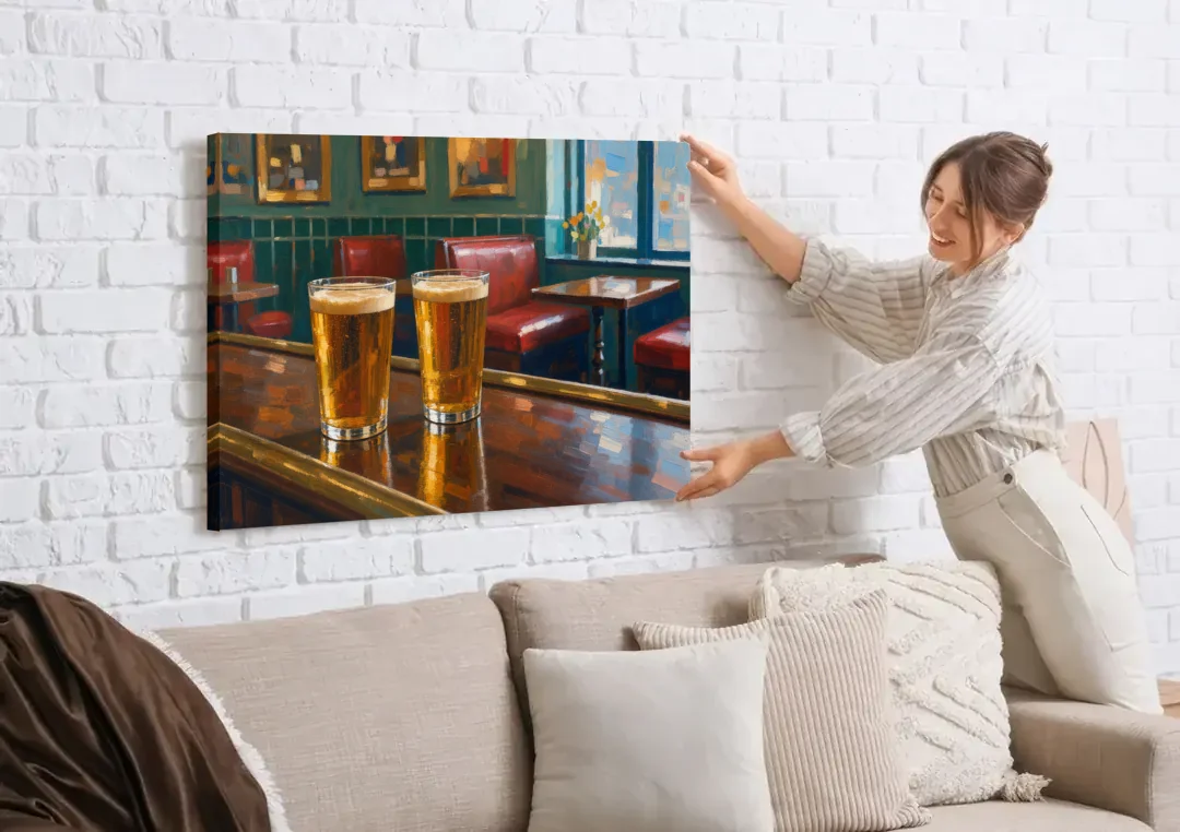 Two Amber Pints at the Brass Rail for the Pub canvas wall art being hung on a white brick wall above a sofa