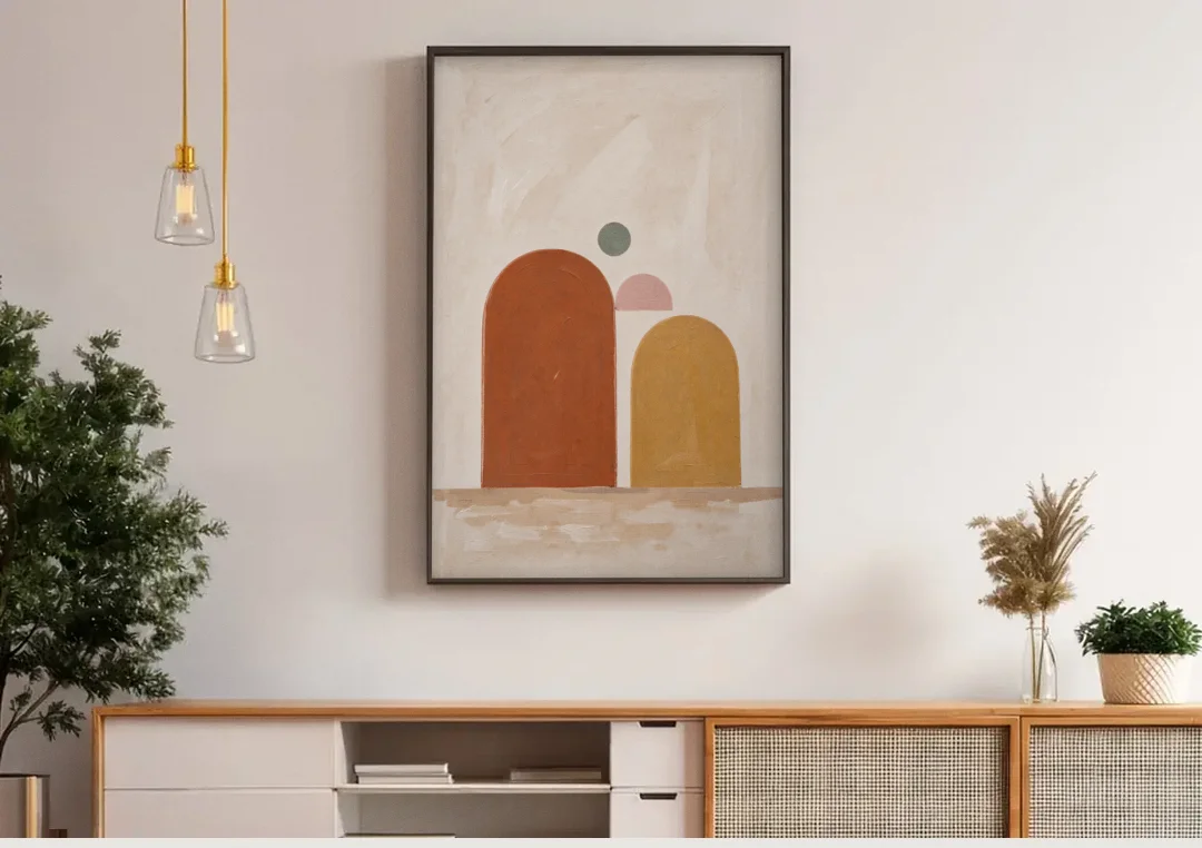 Two Uneven Arches with a Pink Half Sun canvas wall art above a wooden sideboard under pendant lights