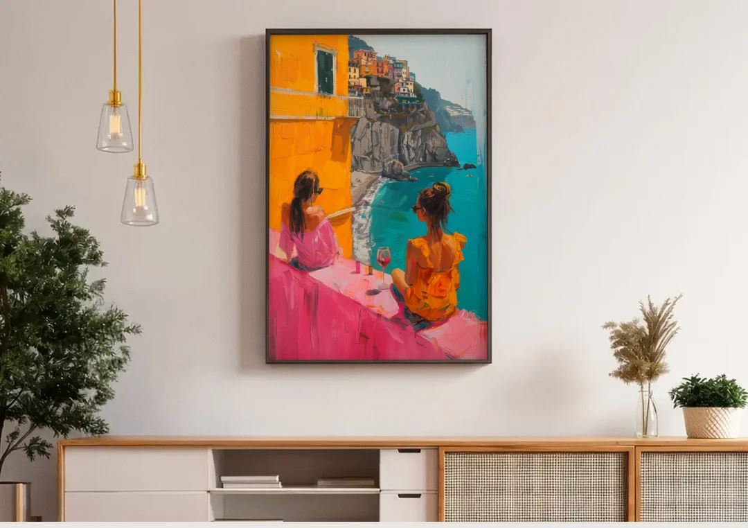 Two Women Painting by the Sea canvas wall art above a wooden sideboard under pendant lights
