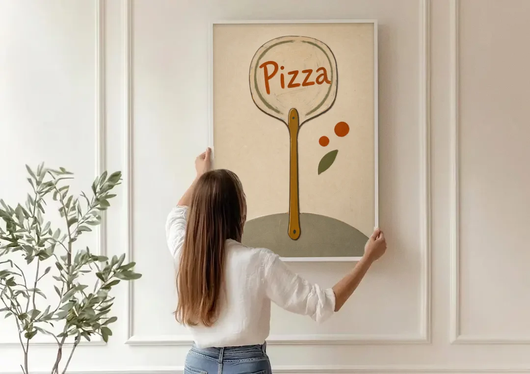 Upright Pizza Peel Sign with Basil Leaf canvas wall art being hung on a paneled wall