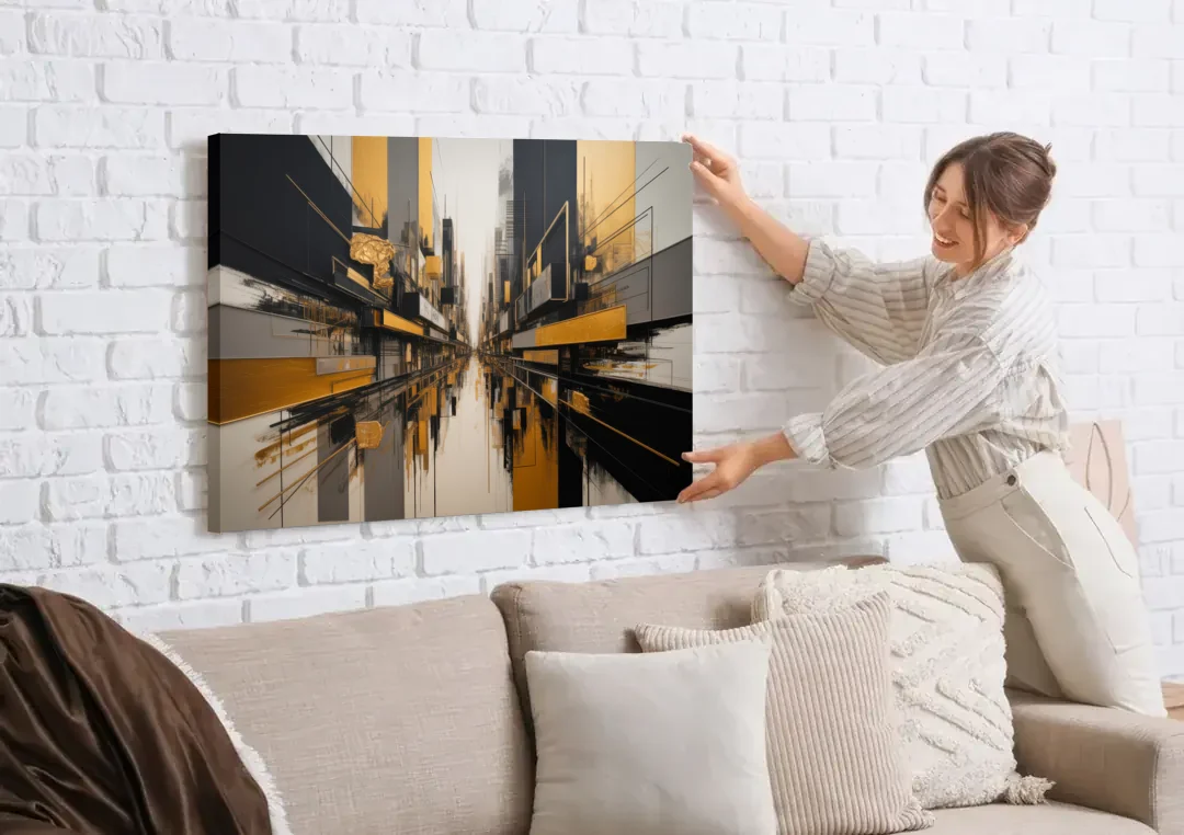 Urban Elegance in Black and Gold Abstract canvas wall art being hung on a white brick wall above a sofa