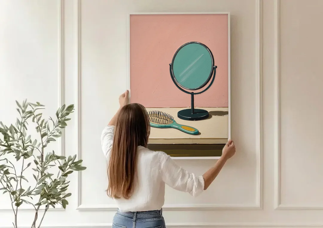 Vanity Wall Art with Round Mirror and Hairbrush canvas wall art being hung on a paneled wall