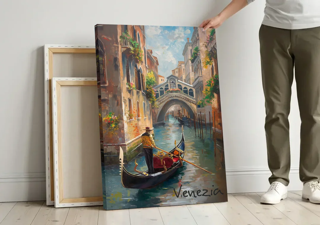 Venice Painting of a Gondolier canvas wall art leaning against a wall next to blank canvases