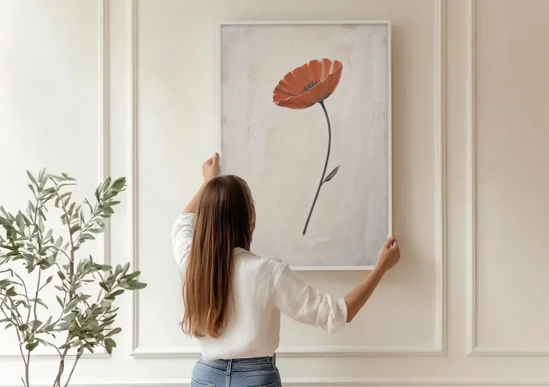 Vermilion Poppy on a Long Black Stem canvas wall art being hung on a paneled wall