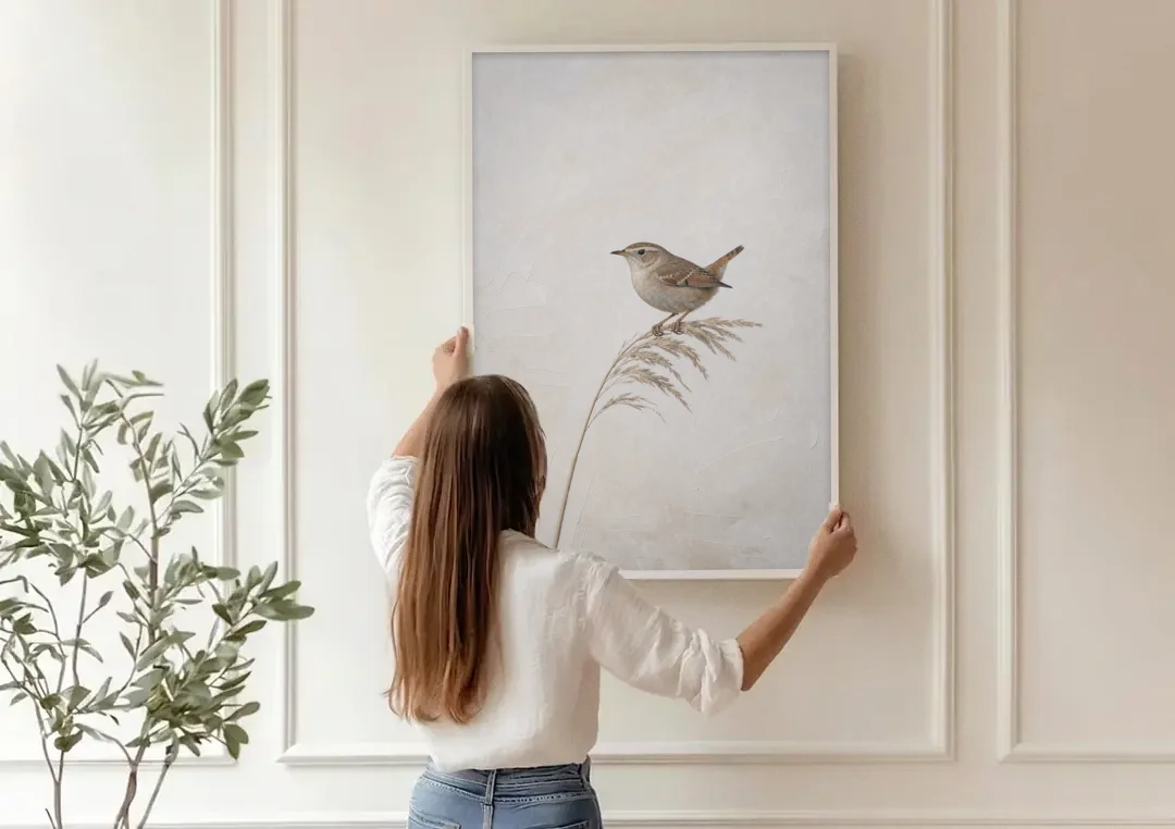Vertical Wall Art Wren on a Dried Grass Stem canvas wall art being hung on a paneled wall