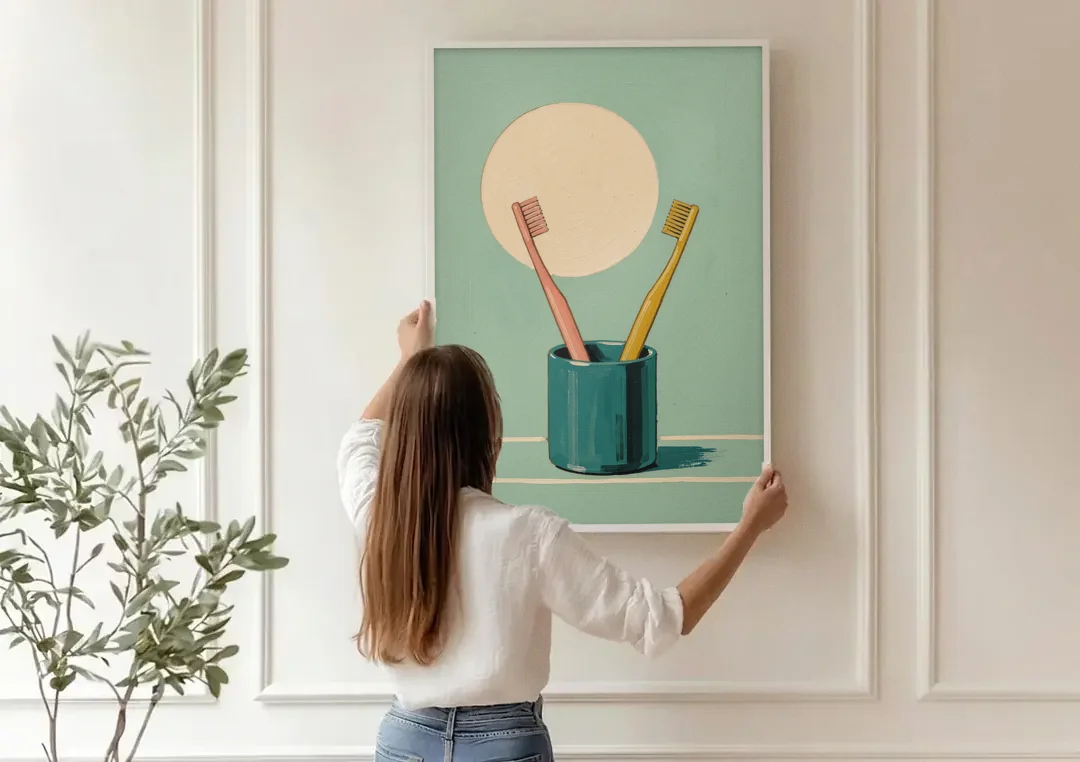 Vintage Bathroom Wall Art of Two Toothbrushes canvas wall art being hung on a paneled wall