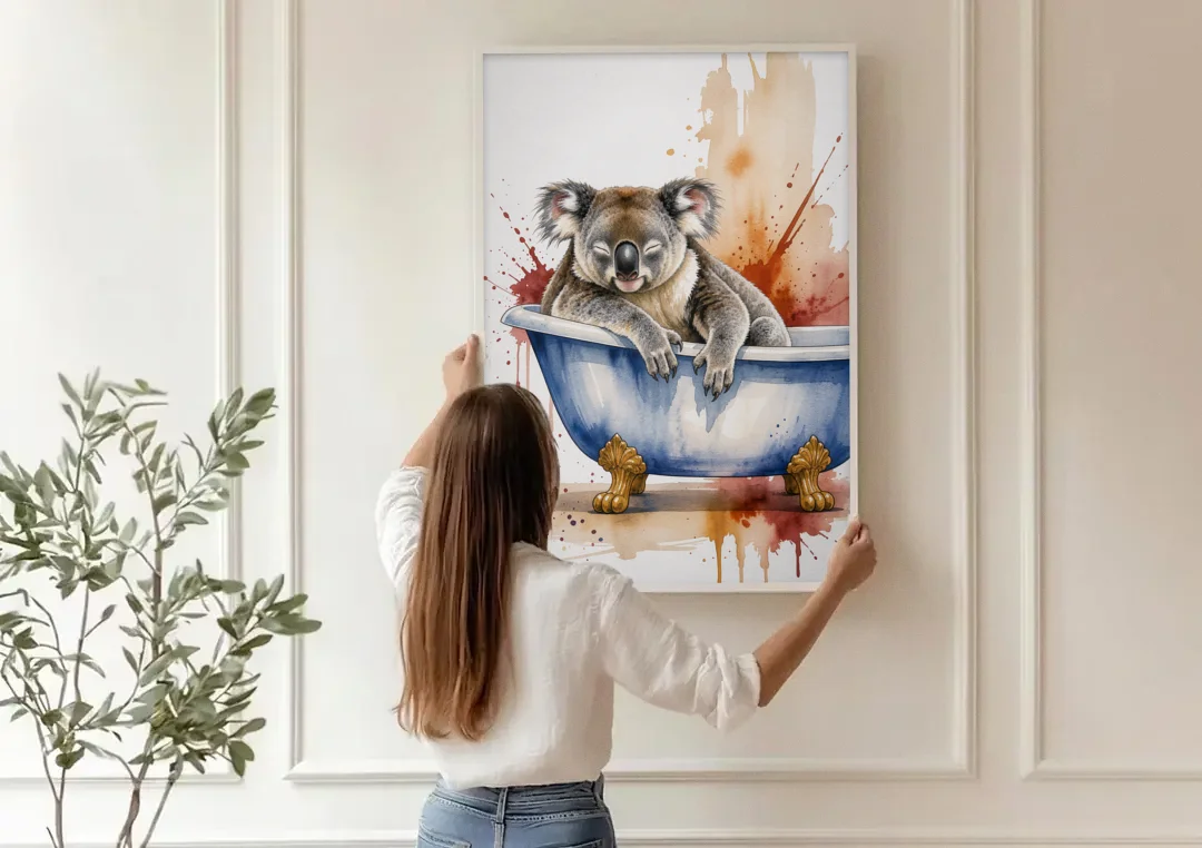 Vintage Bathtub Wall Art with a Sleeping Koala canvas wall art being hung on a paneled wall