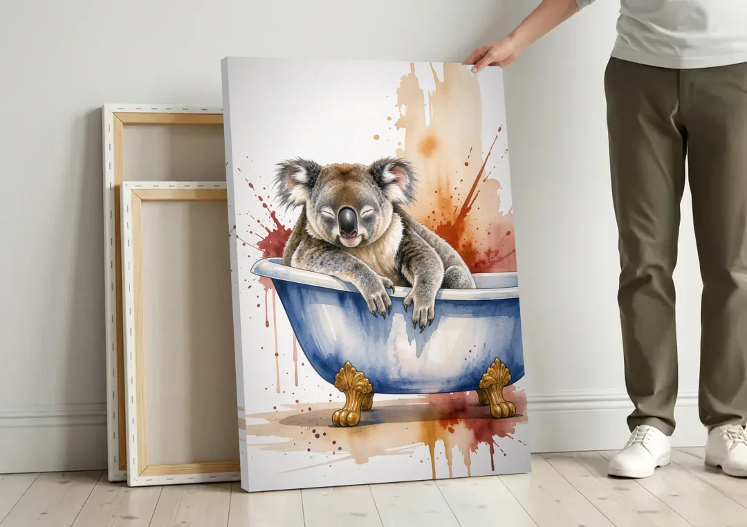 Vintage Bathtub Wall Art with a Sleeping Koala canvas wall art leaning against a wall next to blank canvases
