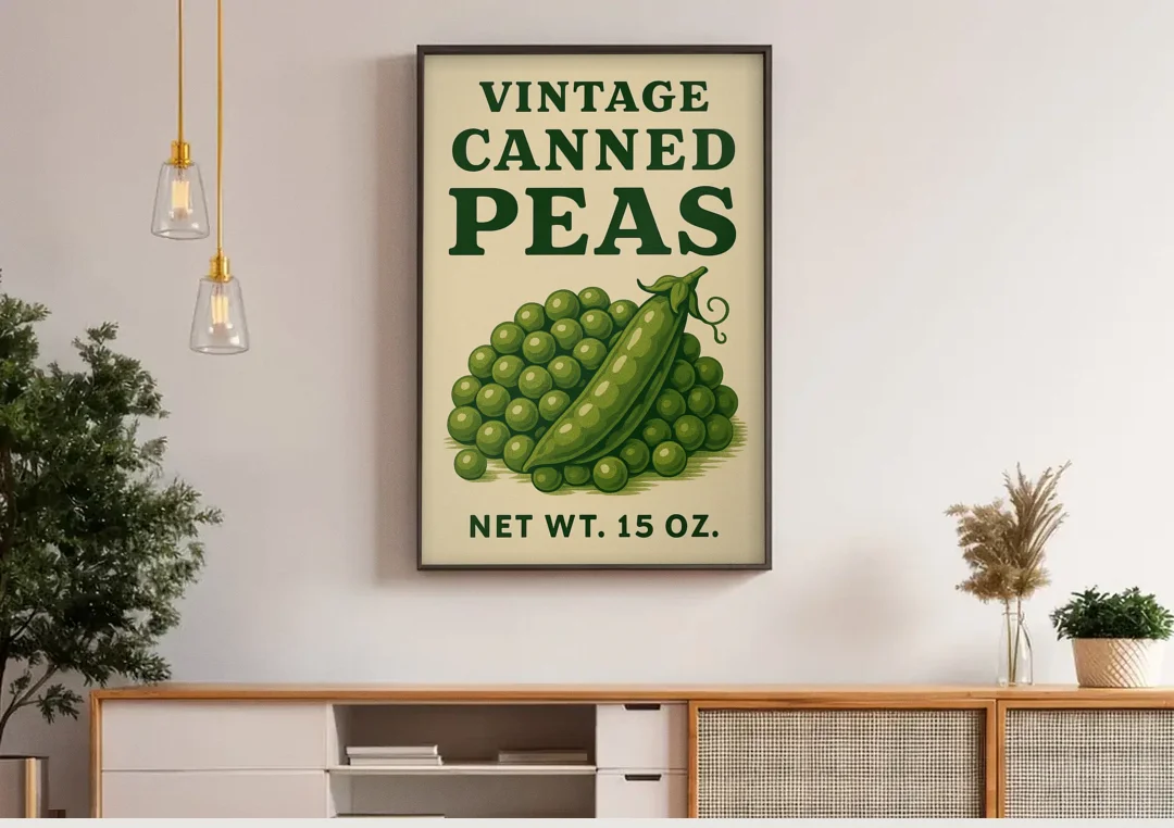Vintage Canned Peas canvas wall art above a wooden sideboard under pendant lights