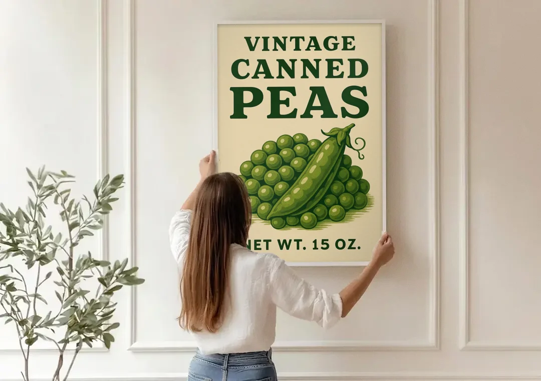 Vintage Canned Peas canvas wall art being hung on a paneled wall