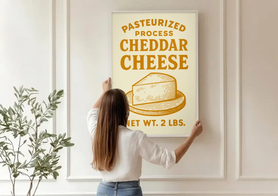 Vintage Cheddar Cheese canvas wall art being hung on a paneled wall