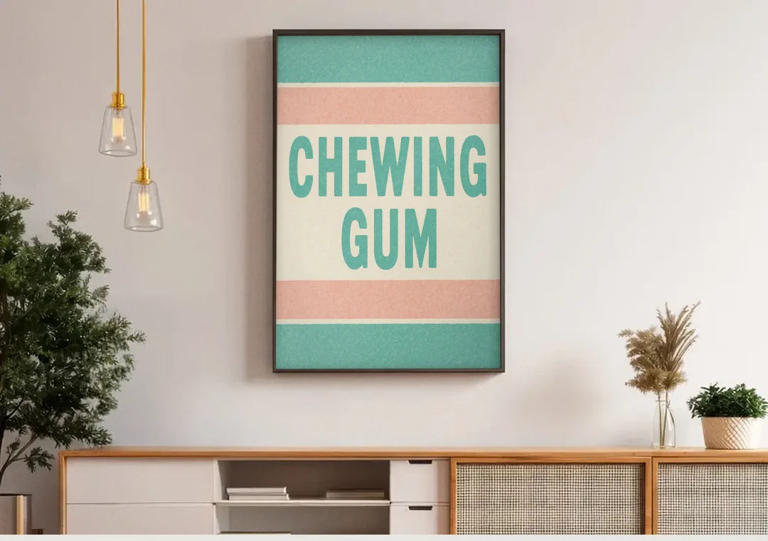 Vintage Chewing Gum canvas wall art above a wooden sideboard under pendant lights