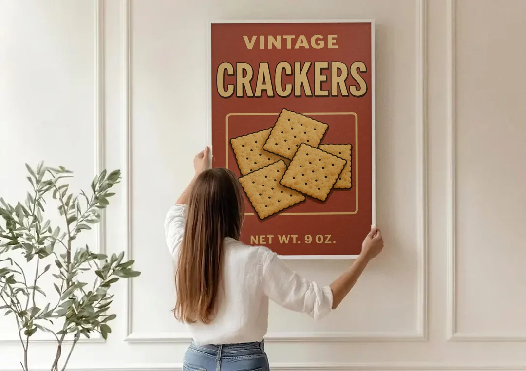 Vintage Crackers canvas wall art being hung on a paneled wall