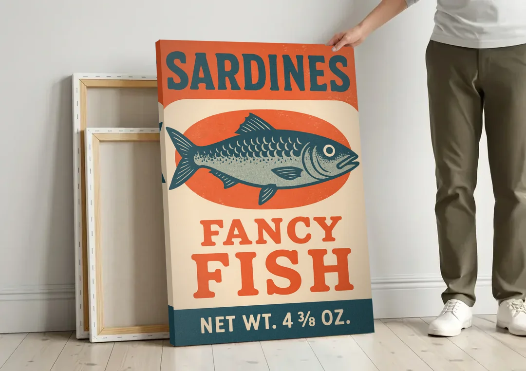 Vintage Fancy Fish Sardines canvas wall art leaning against a wall next to blank canvases