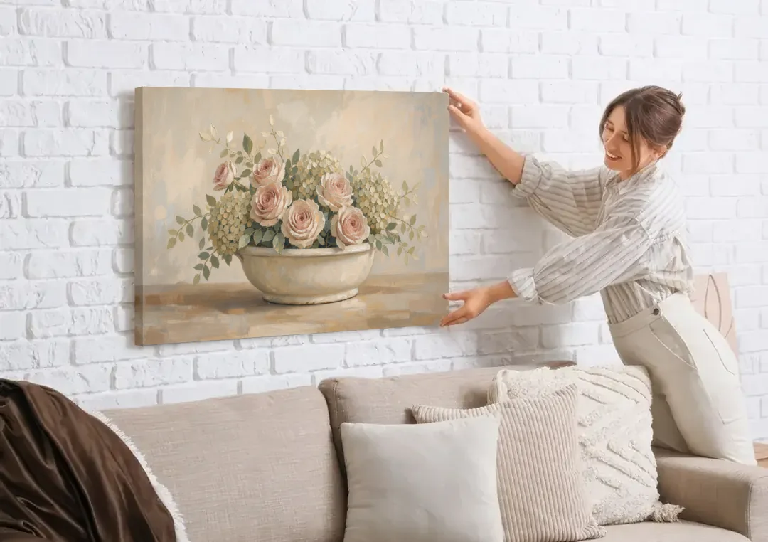 Vintage Flower Wall Art of Roses and Hydrangea canvas wall art being hung on a white brick wall above a sofa