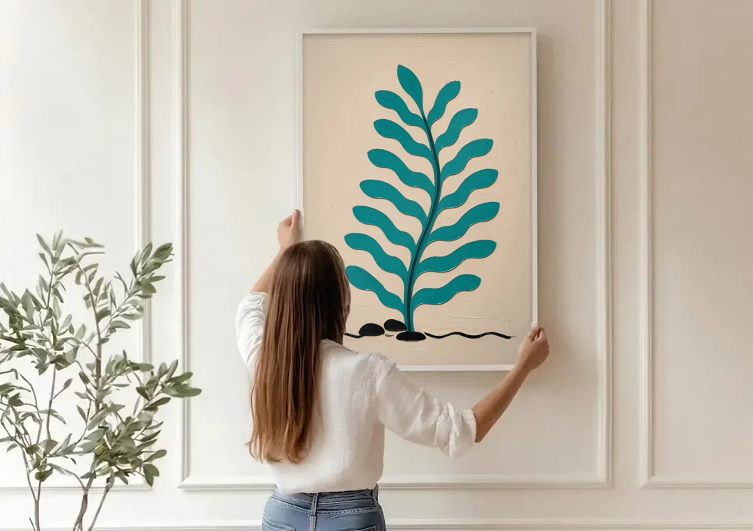Vintage French Wall Art with Aqua Seaweed Fronds canvas wall art being hung on a paneled wall