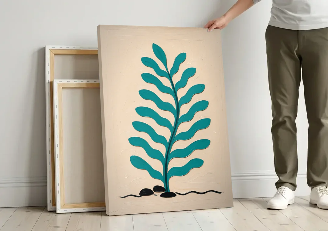 Vintage French Wall Art with Aqua Seaweed Fronds canvas wall art leaning against a wall next to blank canvases