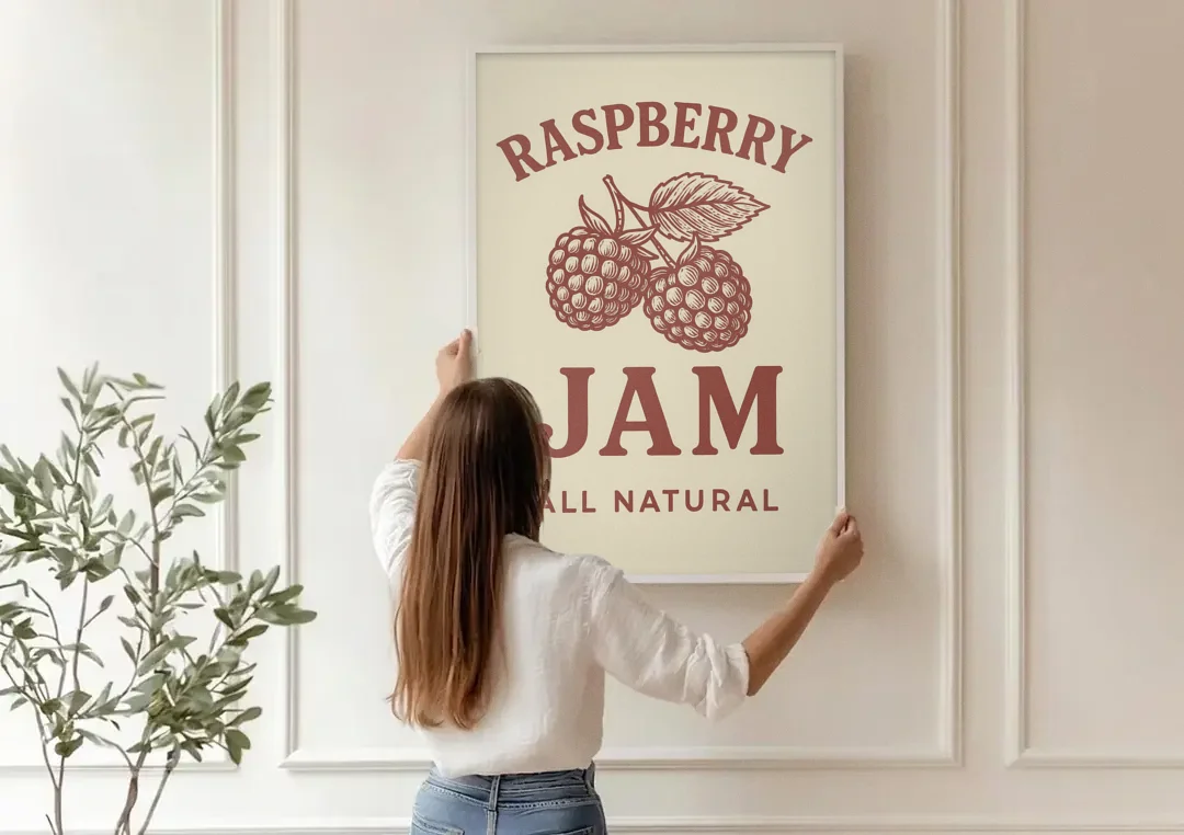 Vintage Raspberry Jam canvas wall art being hung on a paneled wall
