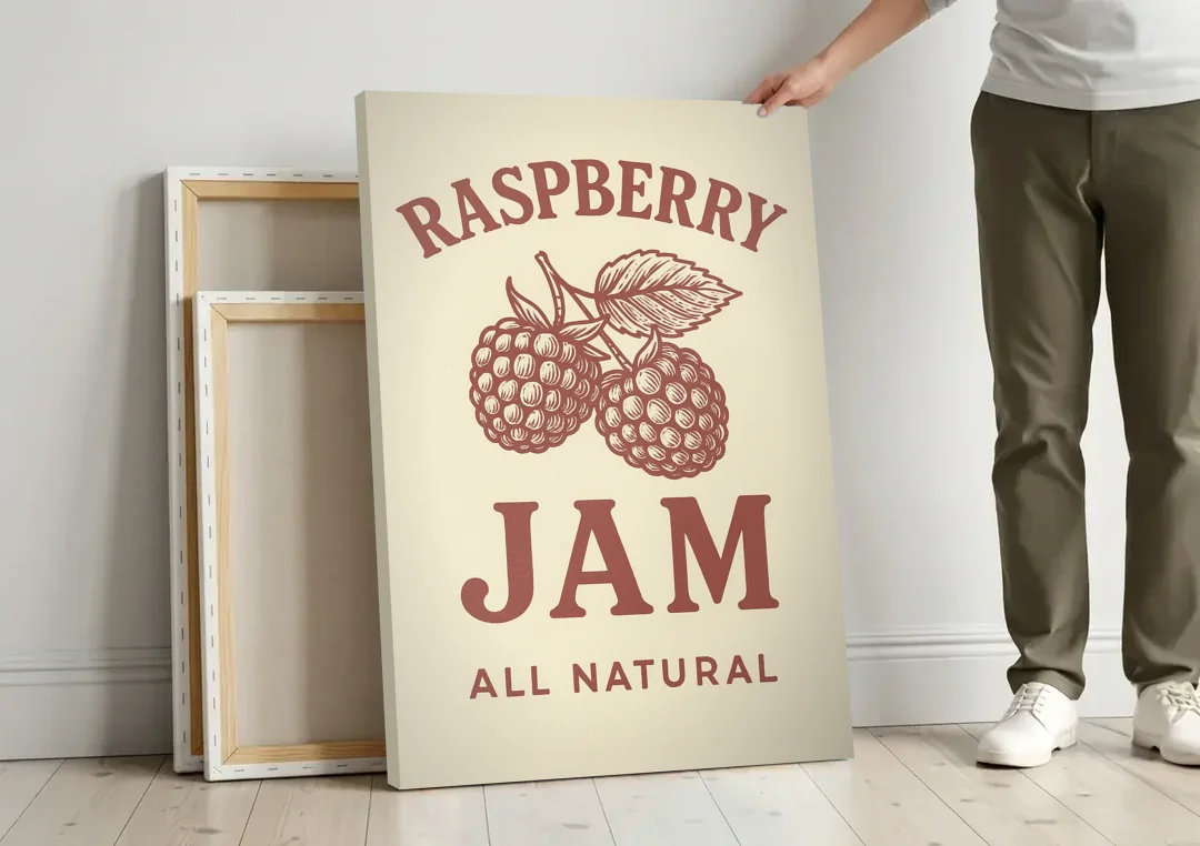 Vintage Raspberry Jam canvas wall art leaning against a wall next to blank canvases