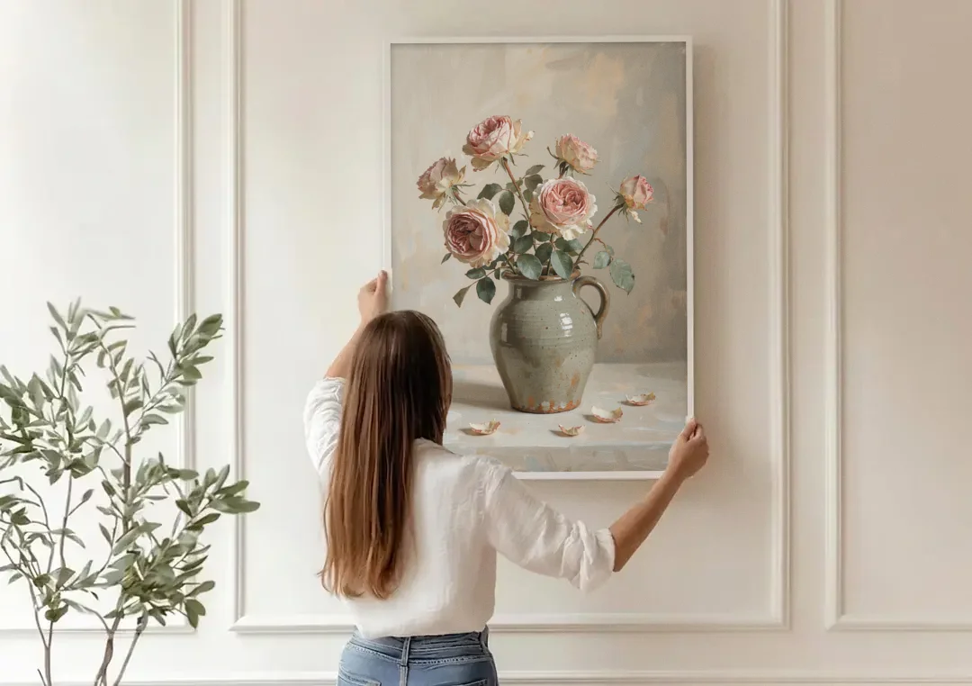 Vintage Rose Painting in a Stoneware Jug canvas wall art being hung on a paneled wall