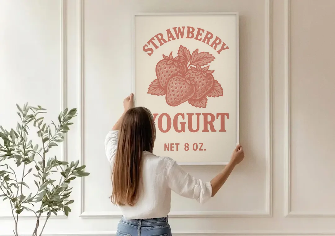Vintage Strawberry Yogurt canvas wall art being hung on a paneled wall
