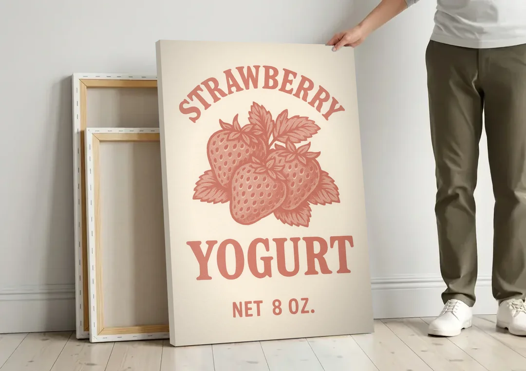 Vintage Strawberry Yogurt canvas wall art leaning against a wall next to blank canvases