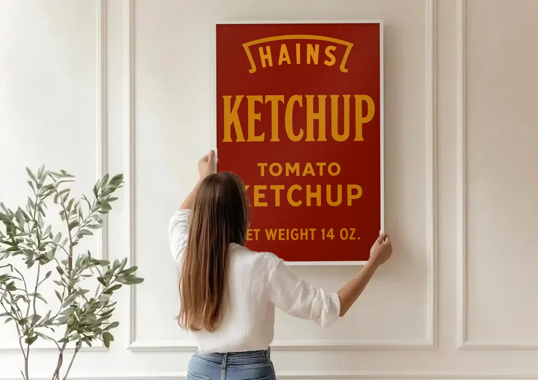 Vintages Hains Tomato Ketchup canvas wall art being hung on a paneled wall