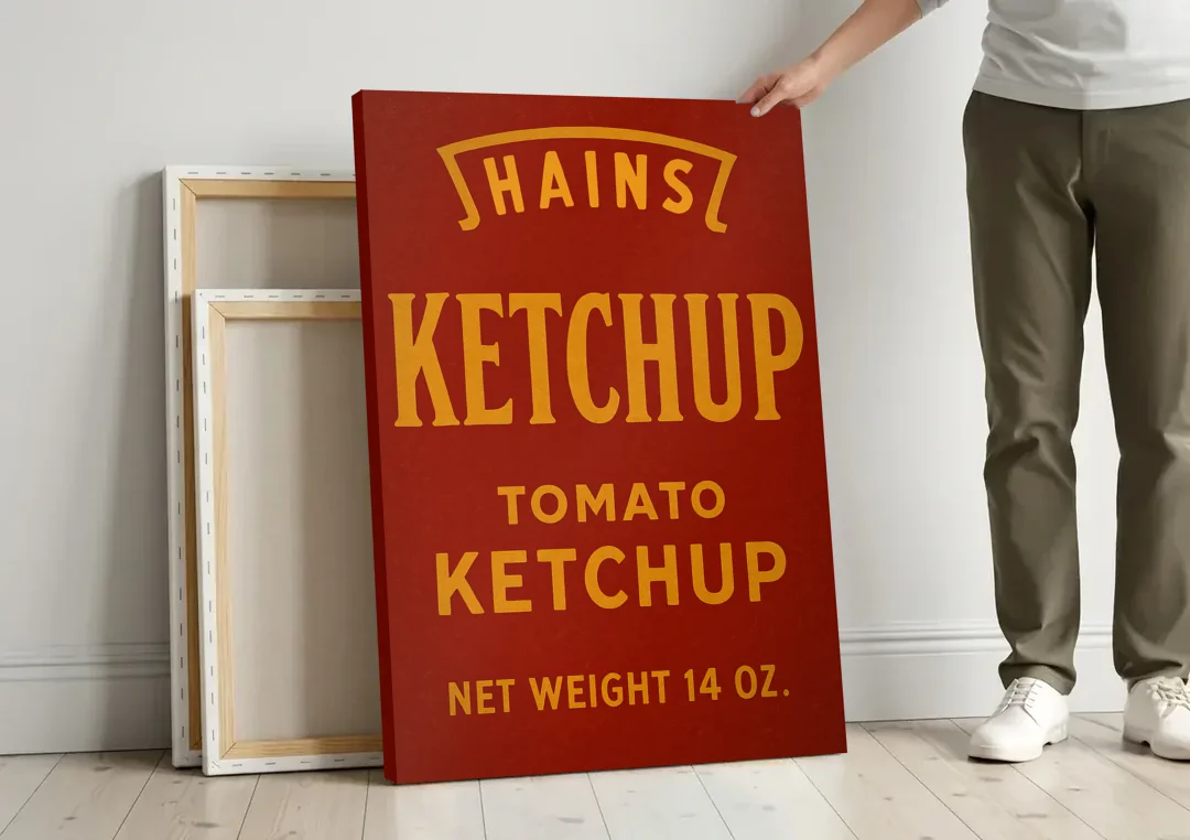 Vintages Hains Tomato Ketchup canvas wall art leaning against a wall next to blank canvases