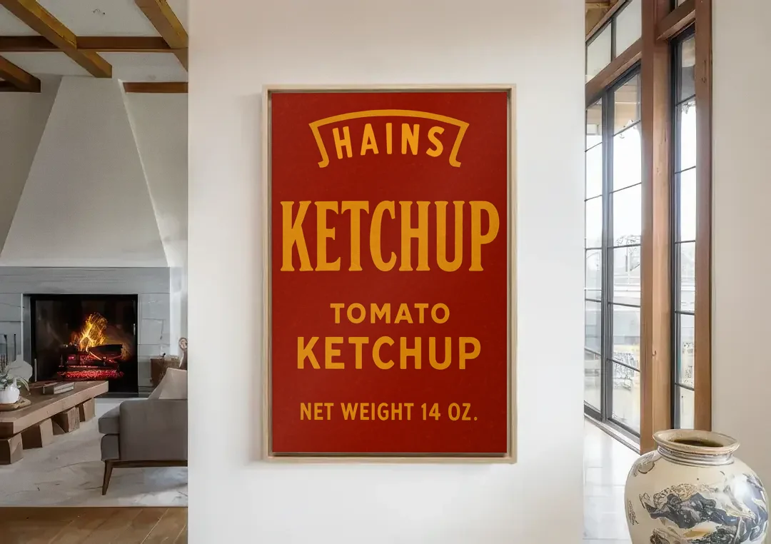 Vintages Hains Tomato Ketchup canvas wall art in a living room with a fireplace