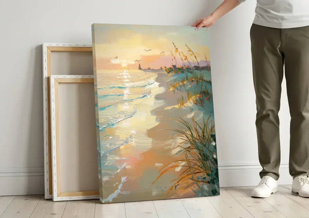 Virginia Beach Coastal Sunrise canvas wall art leaning against a wall next to blank canvases