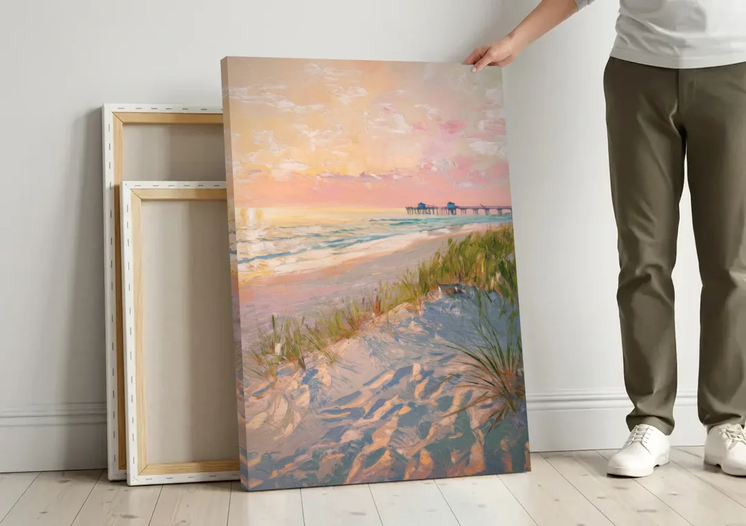 Virginia Beach Oceanfront Serenity canvas wall art leaning against a wall next to blank canvases