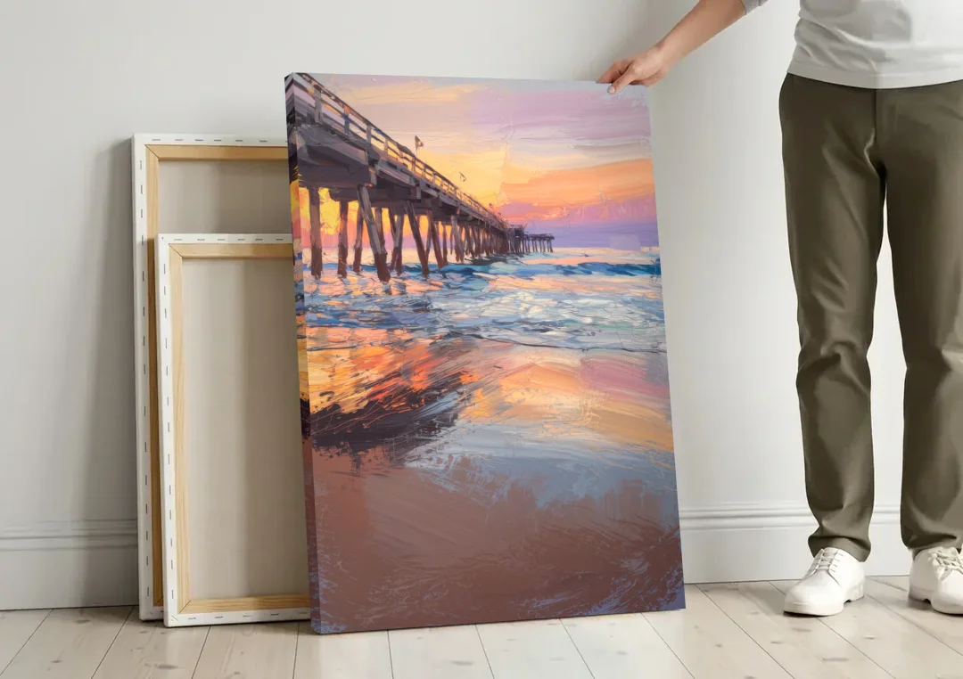 Virginia Beach Pier at Sunset canvas wall art leaning against a wall next to blank canvases
