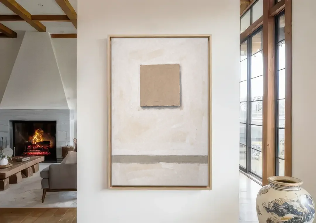 Warm Neutral Wall Art with a Floating Clay Square canvas wall art in a living room with a fireplace