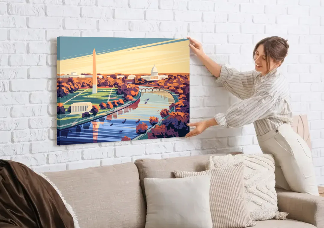 Washington Dc Aerial View canvas wall art being hung on a white brick wall above a sofa