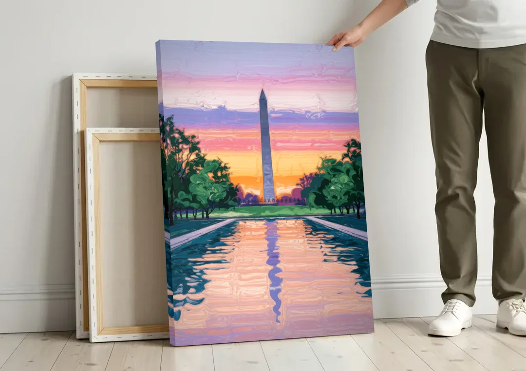 Washington Monument View canvas wall art leaning against a wall next to blank canvases