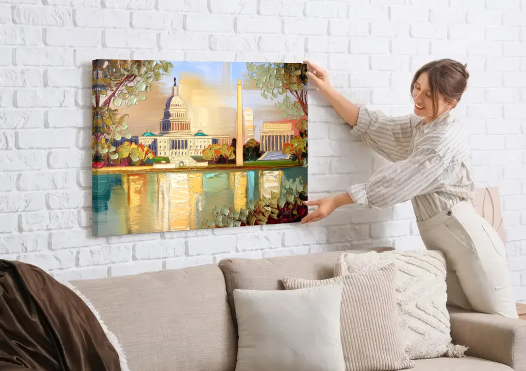 Washington Sunny Cityscapes canvas wall art being hung on a white brick wall above a sofa