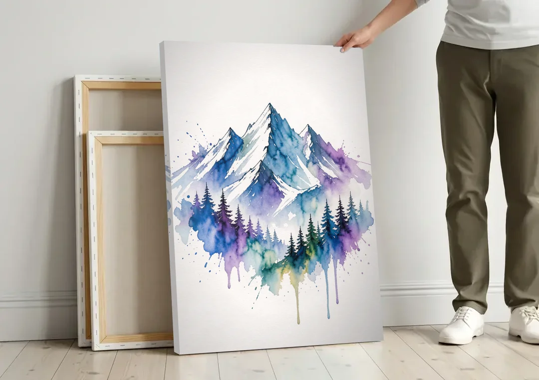 Watercolor Mountain Painting in Violet Bloom canvas wall art leaning against a wall next to blank canvases