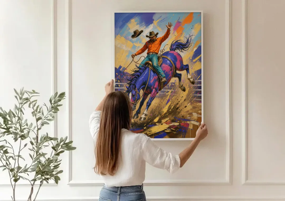 Western Art Prints of a Bronc Rider Thrown High canvas wall art being hung on a paneled wall