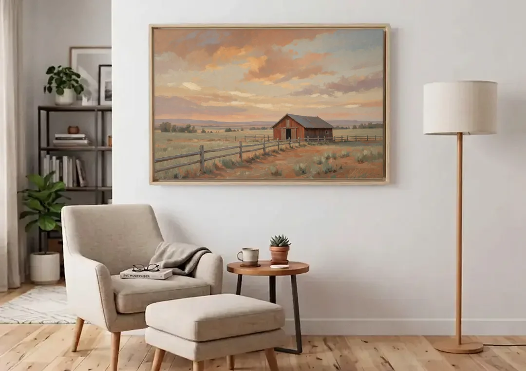 Western Landscape Painting with Lone Red Barn canvas wall art above an armchair in a bright living room
