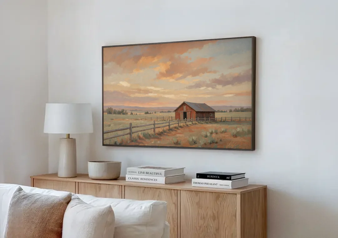 Western Landscape Painting with Lone Red Barn canvas wall art above a wooden sideboard next to a sofa